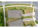 Birds eye view of home showing roof, driveway and surrounding landscaping at 1598 Whitewood Ct, Kissimmee, FL 34747