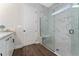 Stylish bathroom with a glass enclosed shower featuring elegant marble tile and a built-in bench at 1598 Whitewood Ct, Kissimmee, FL 34747