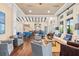 Bright and inviting common area with comfortable seating, dining tables, and stylish decor at 1598 Whitewood Ct, Kissimmee, FL 34747
