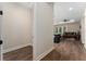 Inviting hallway with hardwood flooring leading to a living room with comfortable seating at 1598 Whitewood Ct, Kissimmee, FL 34747