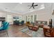 Open-concept living area featuring modern furnishings, tray ceiling, and abundant natural light at 1598 Whitewood Ct, Kissimmee, FL 34747