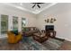 Cozy living room showcasing hardwood floors, neutral decor, and large windows, great for relaxing at 1598 Whitewood Ct, Kissimmee, FL 34747