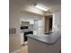 Efficient kitchen with white cabinets, gas range, and plenty of counter space for meal preparation at 1608 Columbia Arms Cir # 126, Kissimmee, FL 34741