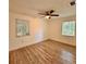 Cozy bedroom with natural light, ceiling fan, and wood-look floors at 1615 Ne 9Th St, Ocala, FL 34470