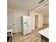 Kitchen featuring modern appliances, wood floors, and access to the living area at 1615 Ne 9Th St, Ocala, FL 34470