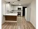 Newly renovated kitchen with stainless appliances, quartz counters and white cabinets at 1615 Ne 9Th St, Ocala, FL 34470