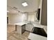 Modern kitchen with white cabinetry, quartz countertops, and stainless steel appliances at 1615 Ne 9Th St, Ocala, FL 34470