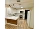 Bright kitchen with white cabinets, stainless steel appliances, and quartz countertops at 1615 Ne 9Th St, Ocala, FL 34470