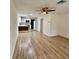 Open-concept living space flows into a modern kitchen with stainless steel appliances at 1615 Ne 9Th St, Ocala, FL 34470