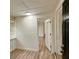 Bright room with laminate flooring and multiple doorways at 1615 Ne 9Th St, Ocala, FL 34470