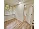 Bright room with laminate flooring and a large window with blinds at 1615 Ne 9Th St, Ocala, FL 34470