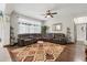Cozy living area with a plush sectional sofa, stylish rug, and ample natural light at 1704 Pine Ridge Dr, Davenport, FL 33896