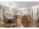 Inviting living room with hardwood floors, chandeliers, and elegant furniture at 1704 Pine Ridge Dr, Davenport, FL 33896