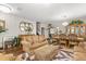 Spacious living area with hardwood floors, plush seating, and stylish decor at 1704 Pine Ridge Dr, Davenport, FL 33896