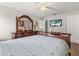Comfortable main bedroom with wood floors, a large dresser, and a mounted television at 1704 Pine Ridge Dr, Davenport, FL 33896