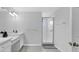 Bathroom featuring dual sinks, a walk-in shower, and ample counter space at 178 Aberdeen St, Davenport, FL 33896