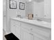 Bathroom featuring double sinks with white cabinetry at 178 Aberdeen St, Davenport, FL 33896