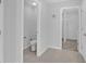 Bathroom featuring toilet, storage, and neutral tiling at 178 Aberdeen St, Davenport, FL 33896