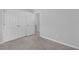 Neutral bedroom with large closet and grey carpet at 178 Aberdeen St, Davenport, FL 33896