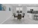 Bright dining area featuring contemporary furniture and decor with natural light, creating an inviting atmosphere at 178 Aberdeen St, Davenport, FL 33896
