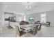Inviting dining area seamlessly integrates the kitchen and living spaces with modern furniture at 178 Aberdeen St, Davenport, FL 33896