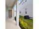 Welcoming covered entry with columns and view of the home's exterior at 178 Aberdeen St, Davenport, FL 33896
