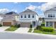 Inviting two-story home with a two-car garage, manicured lawn, and stepping stone pathway at 178 Aberdeen St, Davenport, FL 33896