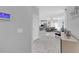 Bright and spacious living room with white tile flooring, modern furnishings, and an open-concept design at 178 Aberdeen St, Davenport, FL 33896