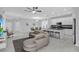 Spacious living room featuring an open-concept design with kitchen, dining and living room at 178 Aberdeen St, Davenport, FL 33896