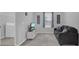 Comfortable living room featuring gray walls, carpet, and a cozy couch at 178 Aberdeen St, Davenport, FL 33896