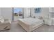 Bright main bedroom boasts large windows, neutral tones, and a modern platform bed at 178 Aberdeen St, Davenport, FL 33896
