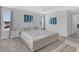 Bright main bedroom boasts large windows, neutral tones, and a modern platform bed at 178 Aberdeen St, Davenport, FL 33896