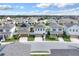 Neighborhood view featuring a charming two-story home with a two-car garage, with manicured lawns at 178 Aberdeen St, Davenport, FL 33896