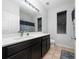 Well-lit bathroom with double sink vanity and tiled flooring at 205 Lakeshore Dr, Davenport, FL 33837