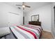 Cozy bedroom featuring a ceiling fan and natural light from a window at 205 Lakeshore Dr, Davenport, FL 33837