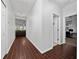 Hallway with dark wood floors leading to the living room at 205 Lakeshore Dr, Davenport, FL 33837