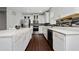 Bright and modern kitchen with white cabinetry, stylish backsplash, and stainless steel appliances at 205 Lakeshore Dr, Davenport, FL 33837