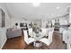 Open-concept living space features a dining area, kitchen, and living room with modern decor at 205 Lakeshore Dr, Davenport, FL 33837