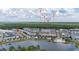 Stunning aerial of community featuring lake, shopping, and walking areas at 2108 Celebration Blvd, Celebration, FL 34747