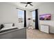 Bright bedroom with a TV and backyard view at 2108 Celebration Blvd, Celebration, FL 34747
