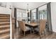 Dining room features a wood table, seating for six, modern lighting, and sliding glass doors at 2108 Celebration Blvd, Celebration, FL 34747