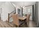 Dining room showcasing table with seating, stairs, and modern lighting at 2108 Celebration Blvd, Celebration, FL 34747