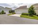Attached one-car garage with concrete driveway and manicured landscaping at 2108 Celebration Blvd, Celebration, FL 34747