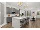 Gourmet kitchen with grey cabinets, quartz countertops, a large island, and pendant lighting at 2108 Celebration Blvd, Celebration, FL 34747