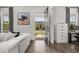 Bright living room showcasing modern decor and a view of the neighborhood from the open doorway at 2108 Celebration Blvd, Celebration, FL 34747