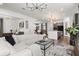 Spacious open-concept living area with modern decor, seamless flow to dining and kitchen at 2108 Celebration Blvd, Celebration, FL 34747