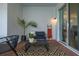 Cozy patio with comfortable seating, patterned rug, and access through sliding glass doors at 2108 Celebration Blvd, Celebration, FL 34747