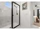Bright shower featuring a black frame, marble-look tile and a window at 2108 Celebration Blvd, Celebration, FL 34747