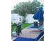 Backyard patio area with a grill, outdoor seating, and a privacy fence, perfect for outdoor entertaining at 2268 Victoria Falls Dr, Orlando, FL 32824