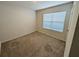 Cozy bedroom with neutral carpet, and a window with blinds at 2479 White Lilly Dr, Kissimmee, FL 34747